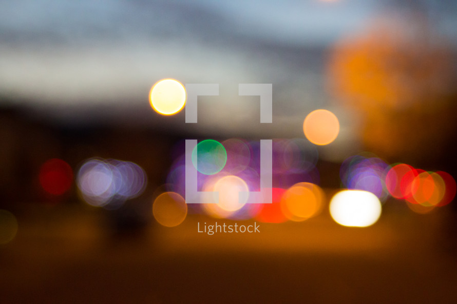 bokeh lights from vehicles at night 