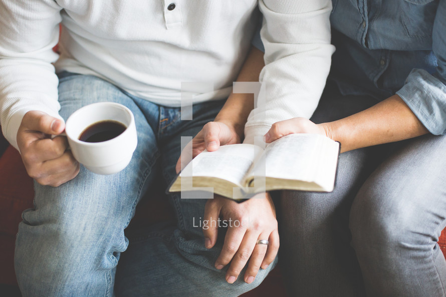 a couple reading a Bible together 