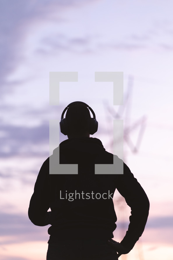 silhouette of a man with headphone 