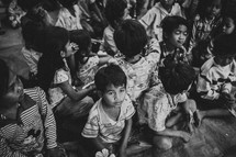 a gathering of children in a village 