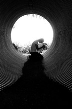 man in prayer in a tunnel 