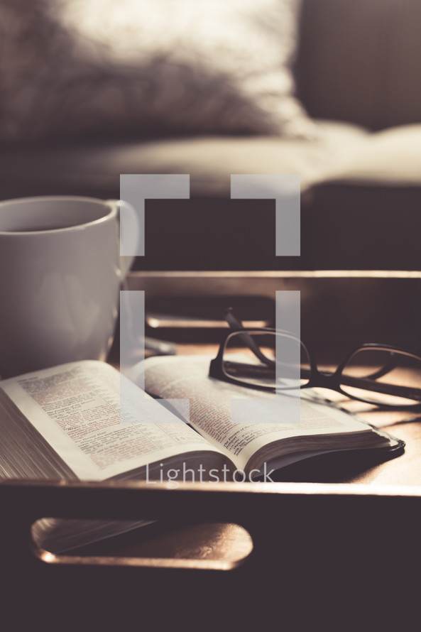 Tea, Bible, and reading glasses on a tray