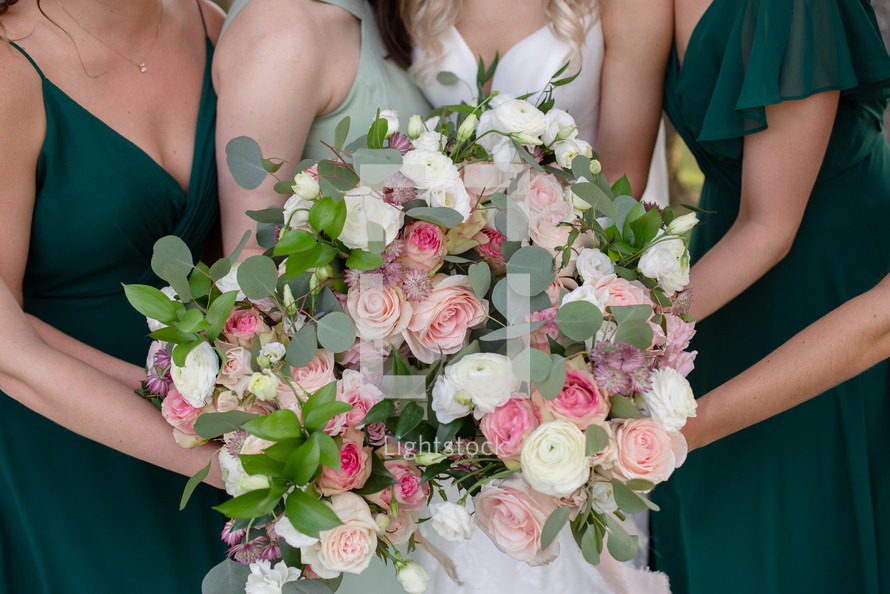 Large bridal bouquet with bride and bridesmaids