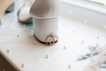 Bride's shoe with wedding rings