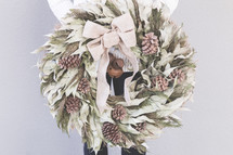 pine cone and dried leaves wreath 