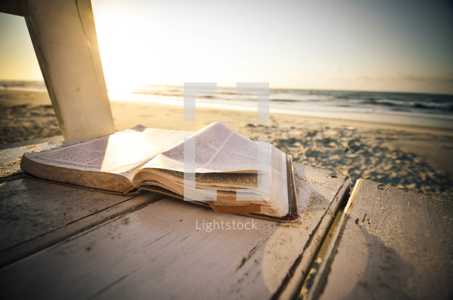 open Bible on a beach