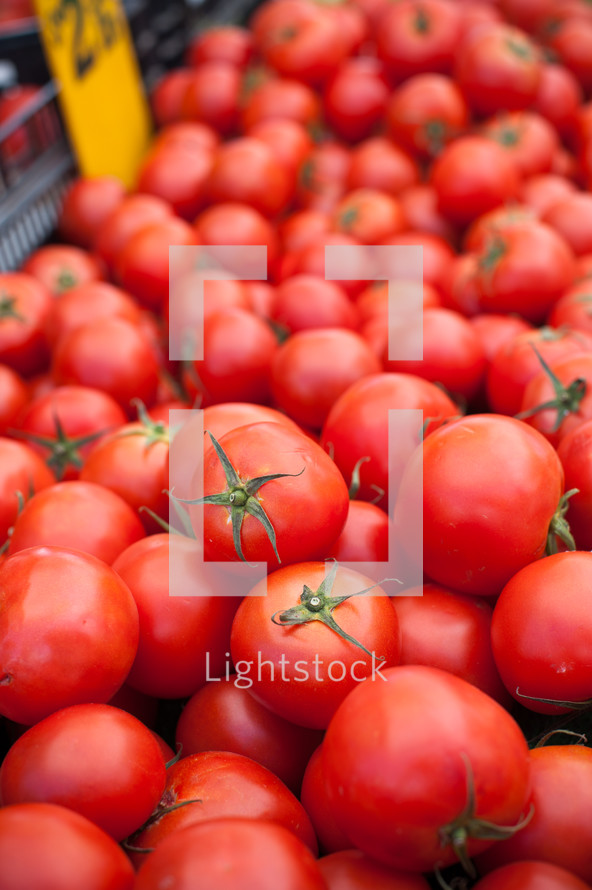 pile of red tomatoes at the market 