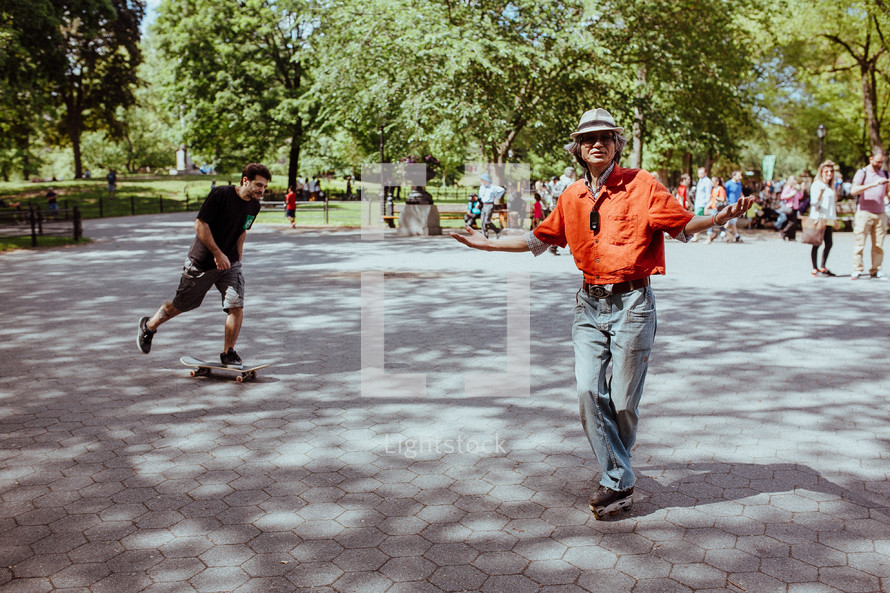 man roller blading in a city park 