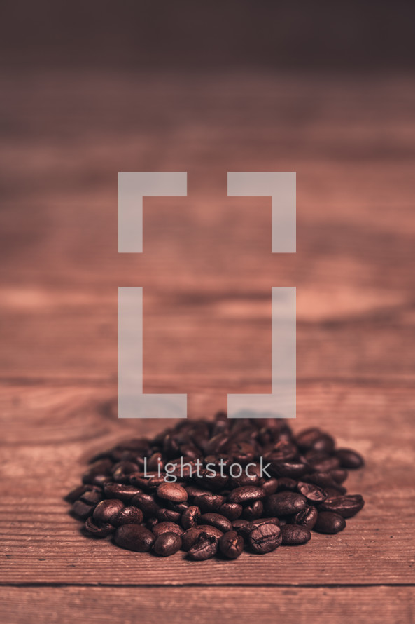 coffee beans on a wood background 