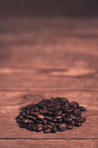 coffee beans on a wood background 