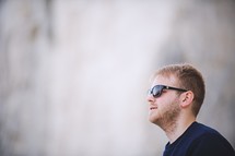 side profile of a man in sunglasses 