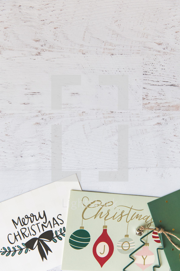 Christmas cards on a white wood background 