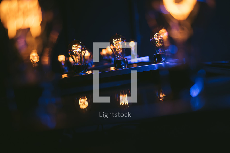 glowing lightbulbs on stage 