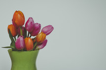 a vase of colorful tulips 