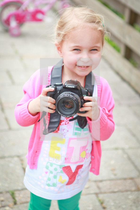 a girl child with a camera 