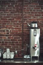 coffee pot and mugs at a restaurant