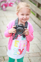 a girl child with a camera 