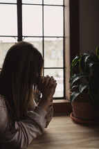 a woman praying 