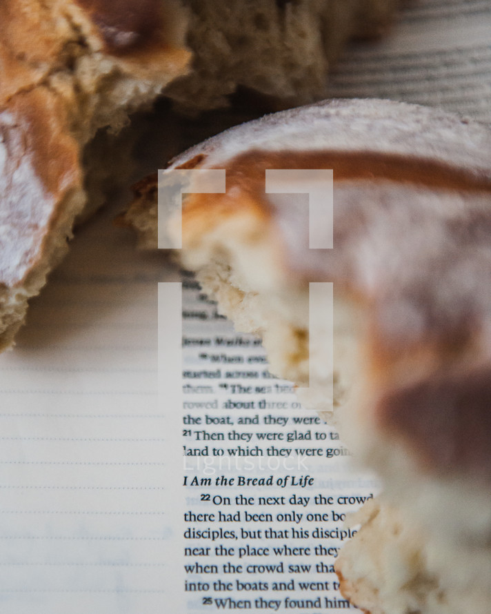 communion bread on the pages of a Bible - I am the bread of life 