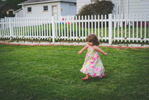 a child running in a backyard 