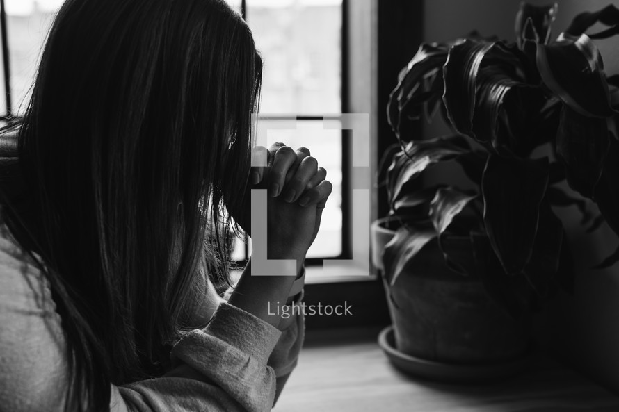 a woman praying 
