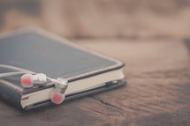 earbuds on a journal 