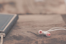 earbuds and journal 