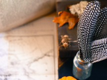 feather, glass bottle, desk, book, map, vintage, fall, leaves