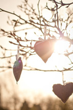 decorative hearts hanging from a tree 