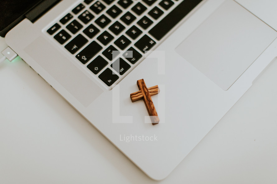 cross on a laptop computer 