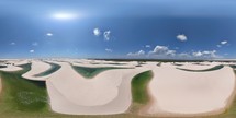 360 aerial photo taken with drone of border of western side of Lençóis Maranhenses and mangue at midday on the northern coast of Brazil