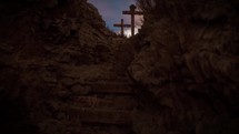 Three empty crosses on Golgotha hill at dawn