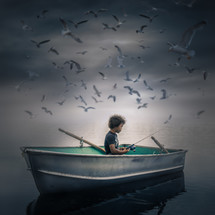 a boy in a fishing boat with seagulls overhead 
