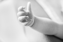 an infant's tiny hand 