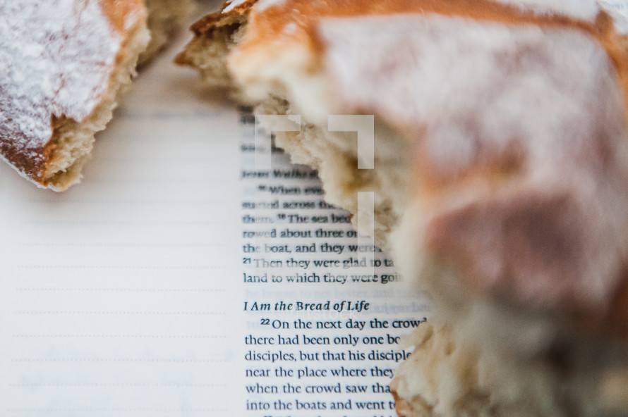 communion bread on the pages of a Bible 