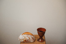 communion wine chalice and loaf of bread 