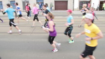Marathons runners running through the streets.