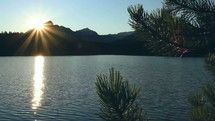 sunset over an alpine lake 