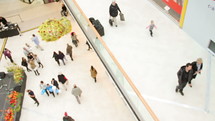 shoppers walking in a mall 