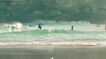 Surfers in the ocean waves.