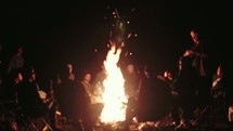 sitting around a campfire 