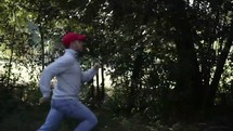 man running through a forest 