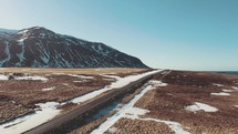 aerial view over a road through Iceland landscape 