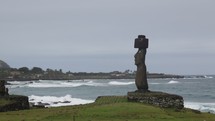 ancient statues along a shore 