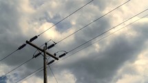 power pole and moving clouds