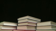 three stacks of books time-lapse 
