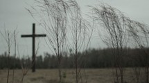 Cross outside in a grassy field.