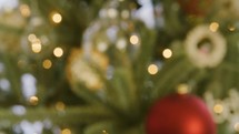 Bokeh to focus on ornament that says Glory to God