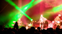 band playing music on stage at a concert 