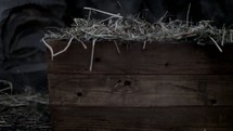 The manger filled with hay in the stable